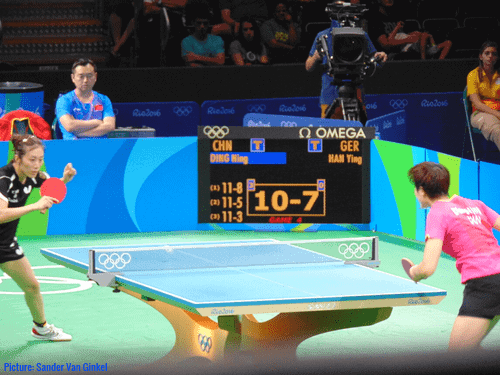 A table tennis singles match involving two players