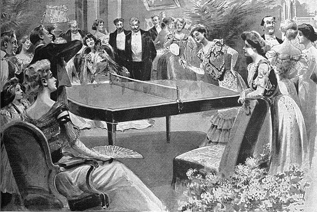 People involved in playing table tennis in a party in 1901