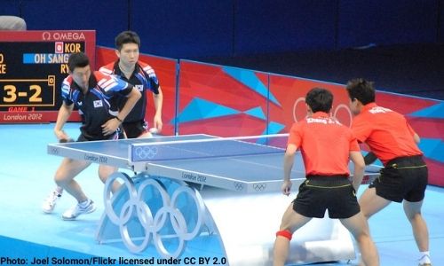 A doubles table tennis match